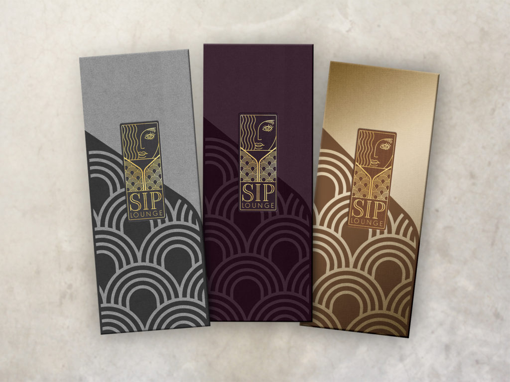 Three art deco style menu covers printed foil stamped