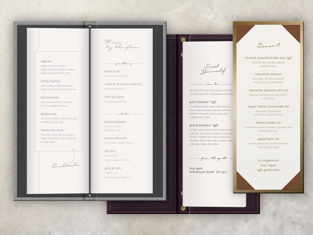 Three art deco style menu covers printed foil stamped