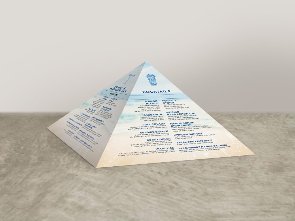 Pyramid table tent with beach themed graphics and blue and black text