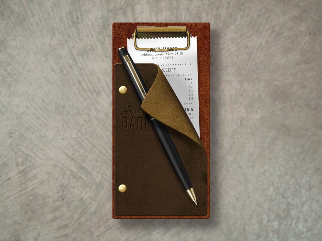 wood check presenter with a brass clip and leather flap