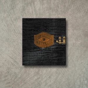 A black shimmer menu cover with a patina copper underlay and embossed logo