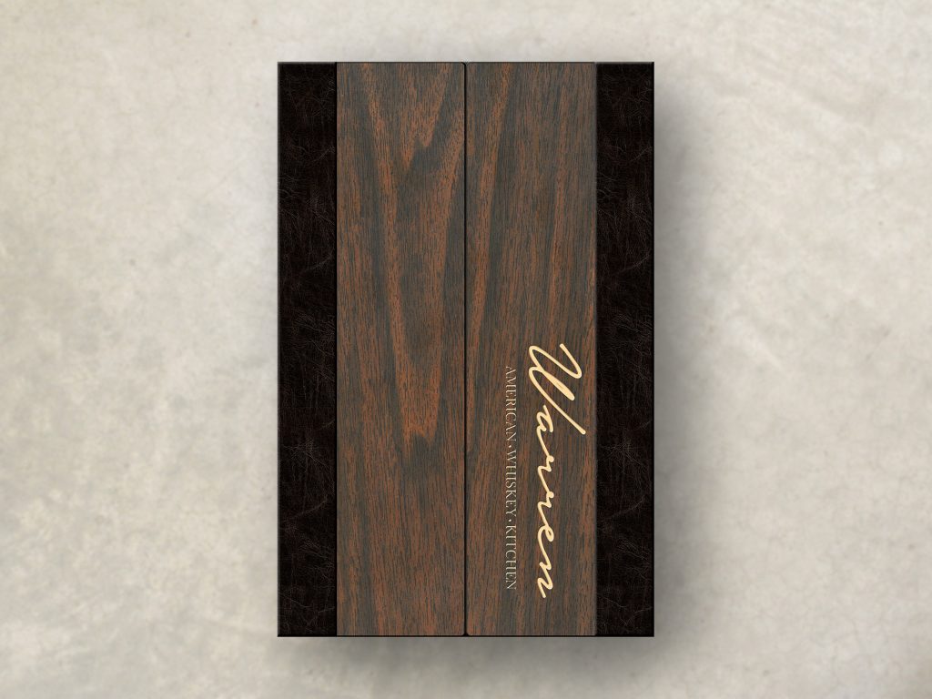 Dark wood gatefold menu with engraved logo